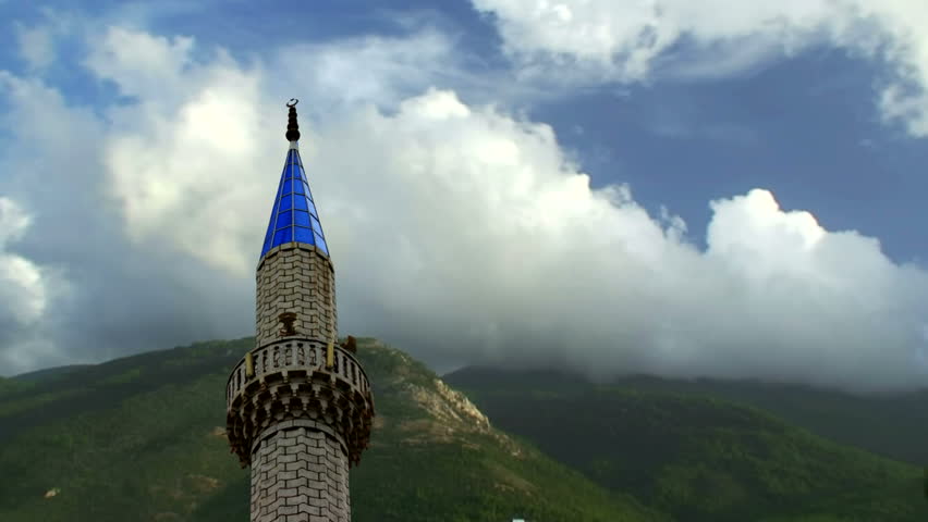 Timelapse clouds behind Turkish mosque minaret