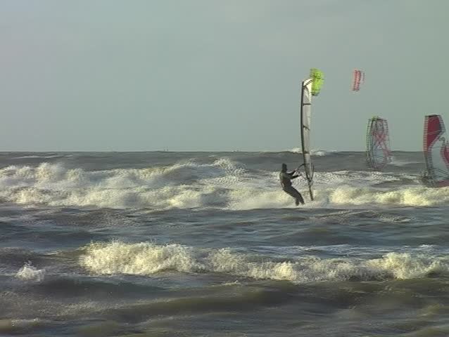 Windsurfing on a wild north sea in the Netherlands