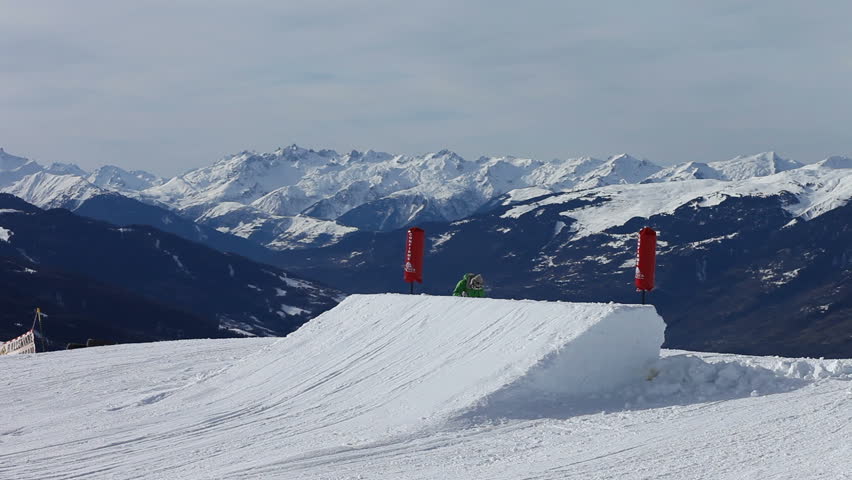 Girl skiing in snowboarding park Trick jump. Location: Bourg-Saint-Maurice, France Source: Canon EOS 5D Mark II
