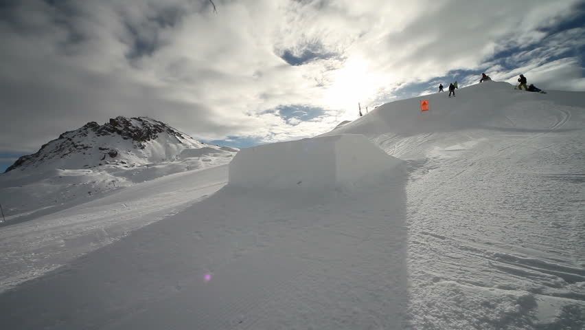Girl skiing in snowboarding park Trick jump. Location: Bourg-Saint-Maurice, France Source: Canon EOS 5D Mark II