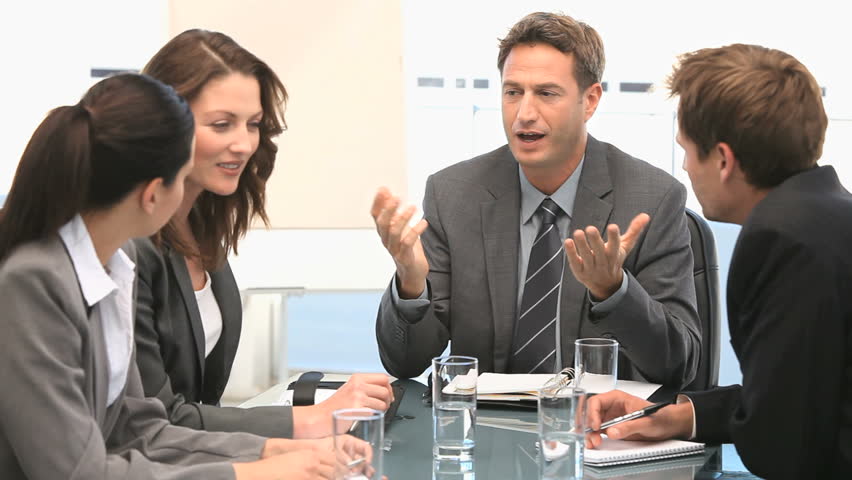 Businessman talking with his coworkers