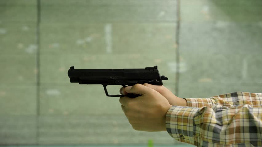 Large 9mm pistol firing