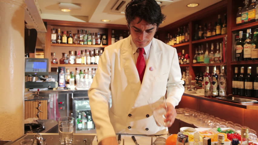 A series of model released clips featuring a male cocktail waiter in a classic looking cocktail bar in barcelona, Spain