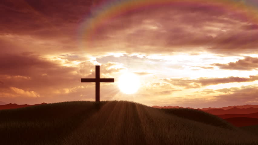 Christian crosses on a hill at sunset