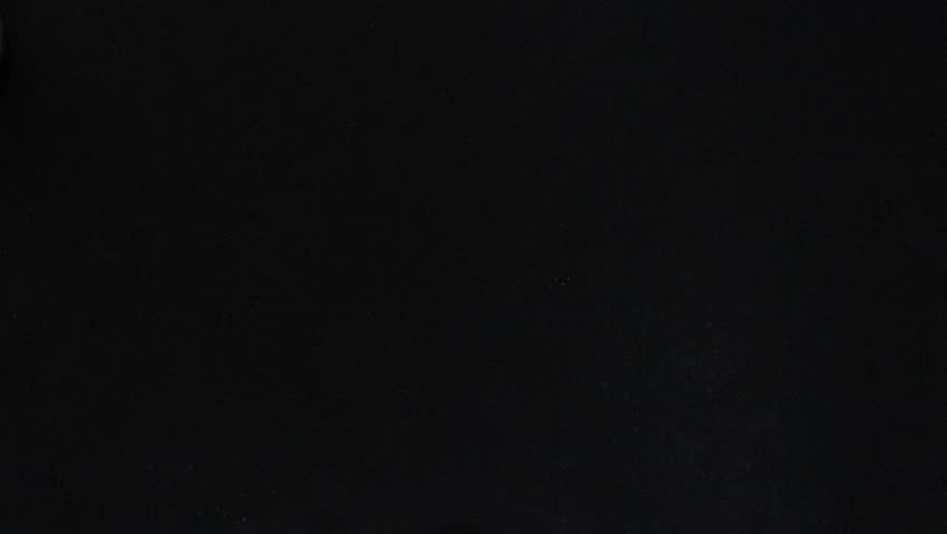 someone drawing a lightbulb with chalk on a blackboard
