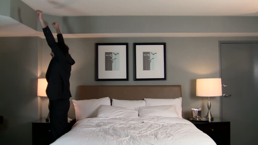 Businessman falls backwards onto bed - HD