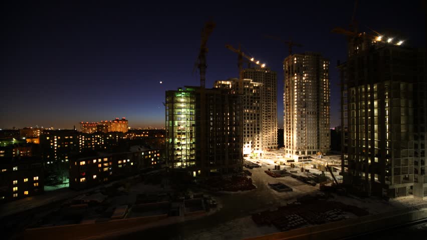 Overview of construction site in night, time lapse