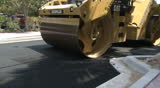 SOUTH BEACH - MAR 29: Road roller March 29th, 2011 in South Beach, Florida. Road construction crews provide infrastructural upkeep for South Florida's 10 million yearly visitors.
