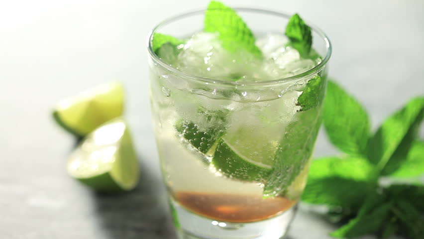 close up of fresh made mojito placing  fresh mint