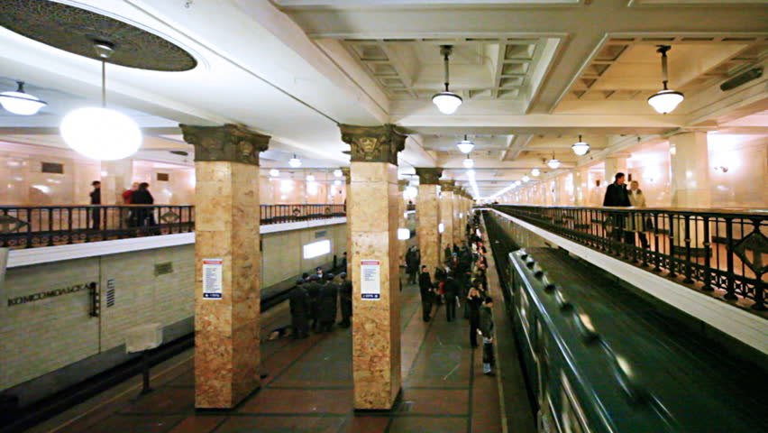 revival of passengers on subway and train arrives right side at station Komsomolskaya Moscow Metro