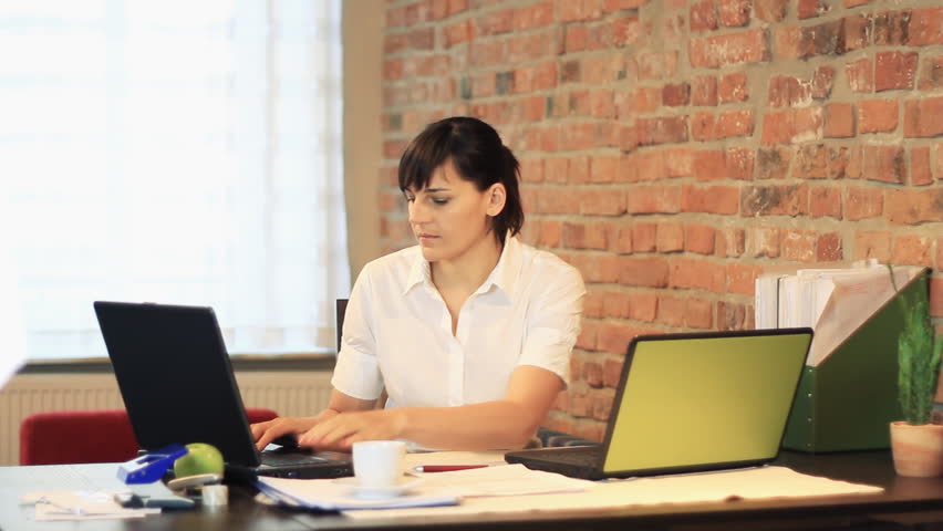 Busy multitasking attractive businesswoman in the office, timelapse 