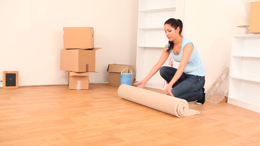 Brunette happy to install her things in her new apartment