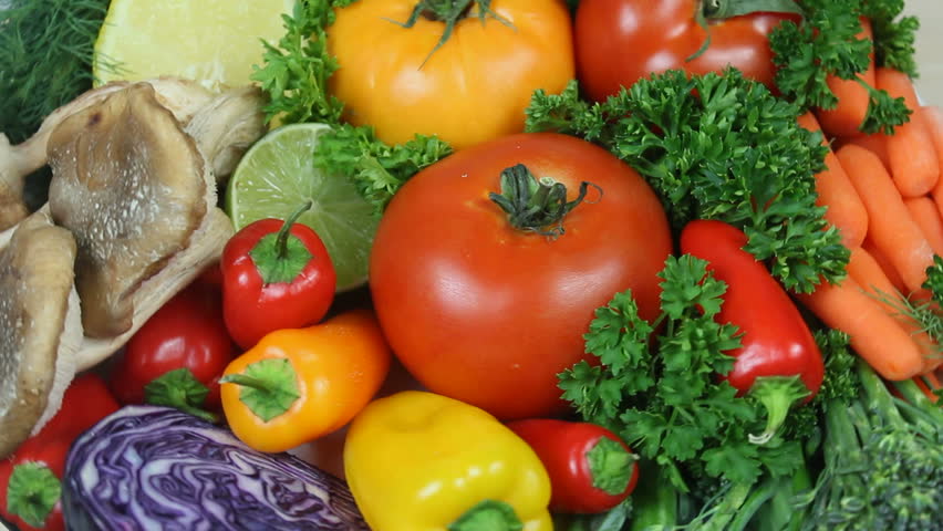 Fresh, organic tomatoes, carrots, mushrooms, parsley, broccoli, cabbage and peppers rotate, close up. 1080p