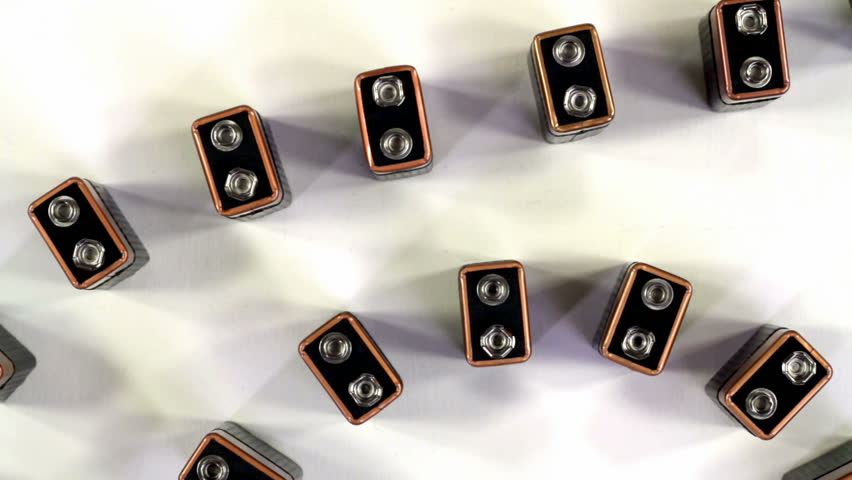 9-Volt Batteries falling like dominoes shot from above