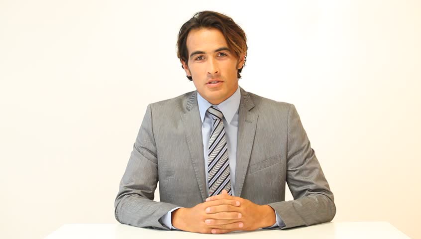 Man speaking to camera on white background