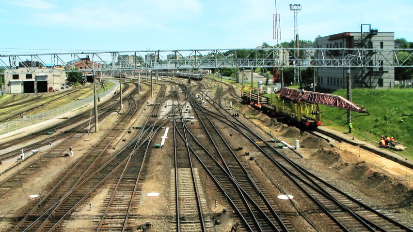 VILNIUS, LITHUANIA - JUNE 14: (Timelapse view) Modern electric double- deck trains pass railway near Vilnius railway station, June 14, 2011 in Vilnius, Lithuania. Lithuanian railways transport around 48 million tons of cargo per year.  