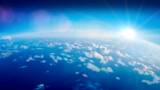 Globe earth view from above. Aerial shot of ocean view with clouds and water below. Sunny weather with Pacific ocean view from above.