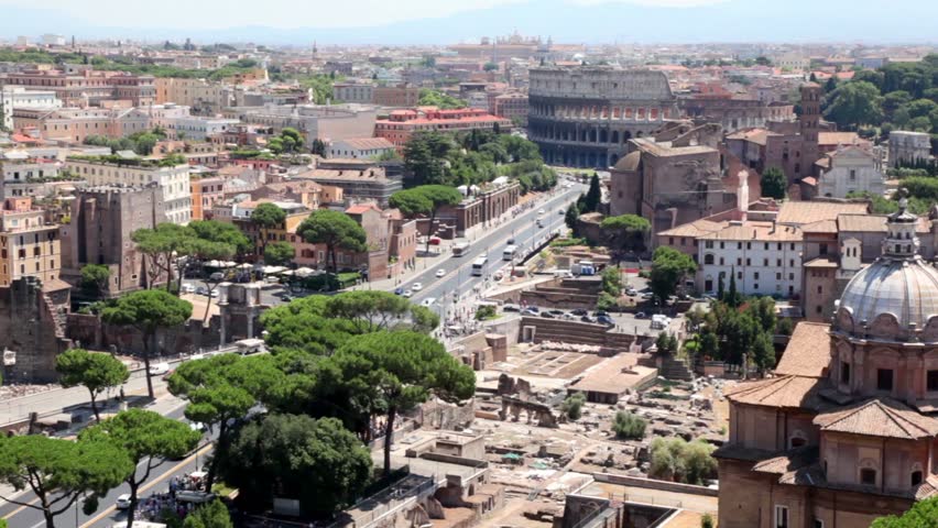 Cityscape from above, shows the Imperial Forums street leading to the Coliseum