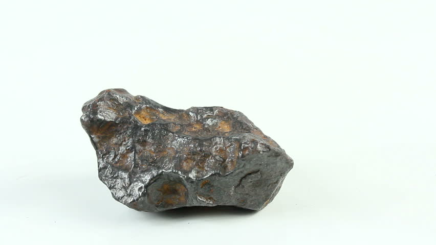 A chunk of stony iron meteorite, a fragment that survived a meteorite's fiery descent through earth's atmosphere exhibits magnetic properties. 1080p