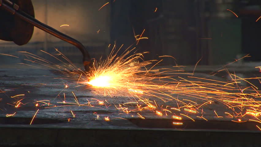 A worker welding as sparks fly 