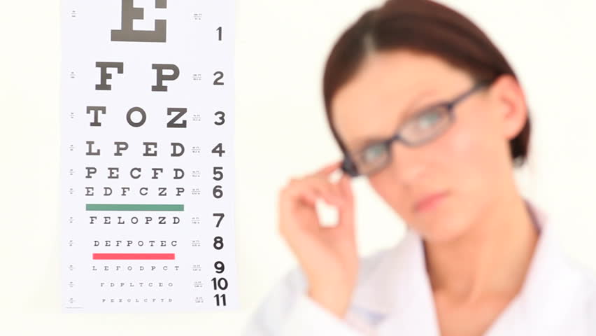 Female ophthalmologist posing against a white background