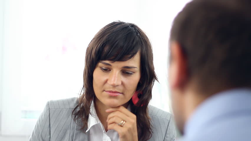 Young businesswoman giving reprimand from boss