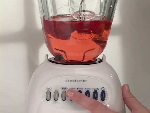 Female hand turns blender on and off