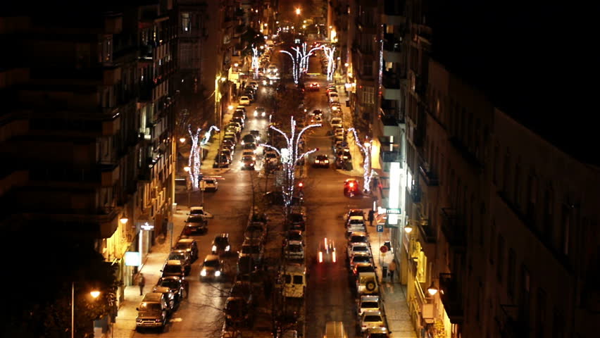 A night time time-lapse video of city street in Lisbon, Portugal.