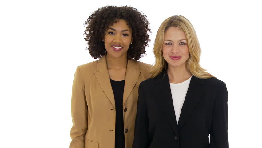 Two businesswomen giving thumbs up to camera