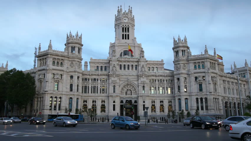 MADRID - APRIL 23: Evening traffic in front of Plaza de Cibeles, April 23, 2011, Madrid, Spain. The Plaza de Cibeles is a square with a neo-classical complex of marble sculptures with fountains that has become an iconic symbol for the city of Madrid.