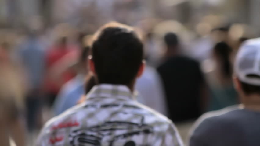 Unrecognizable crowd, people walking, slow motion  