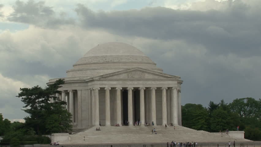 A plane flying by Jefferson Memorial