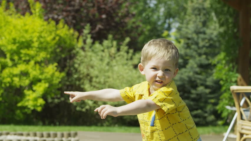 Boy pointing at something.