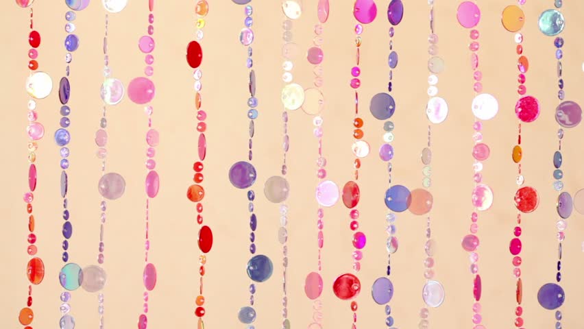 Curtain fragment made of varicoloured plastic beads
