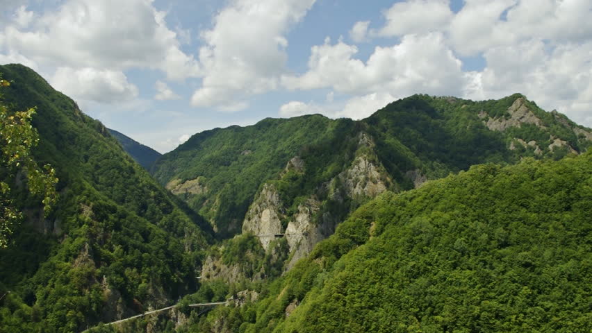 clouds over mountains  with shadows timelapse