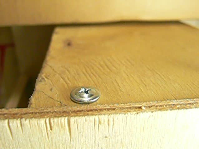 unscrew and remove wood-screw