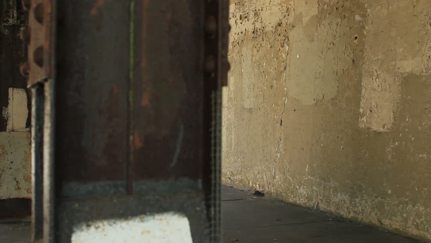 Homeless man sitting under a bridge, dolly shot