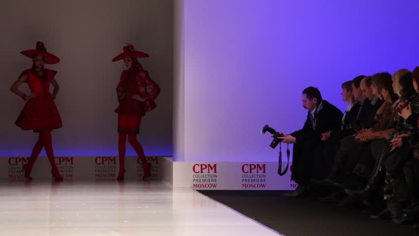 MOSCOW - FEBRUARY 22: Women wear red suits and hats from Slava Zaytzev and walk the catwalk in the Collection Premiere Moscow, on February 22, 2011 in Moscow, Russia.