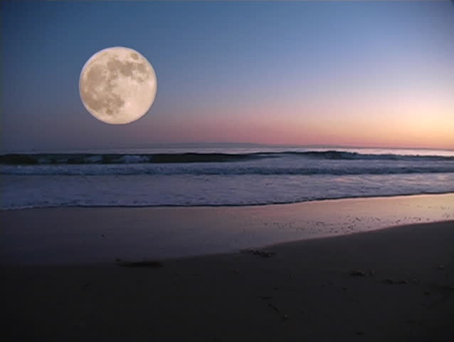 Moon over pacific ocean at dusk.
