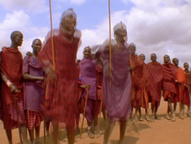 KENYA - CIRCA 2010: Masai people jump for the camera in slow motion circa 2010 in Kenya. Masai people are a Nilotic ethnic group of semi-nomadic people located in Kenya and northern Tanzania. 