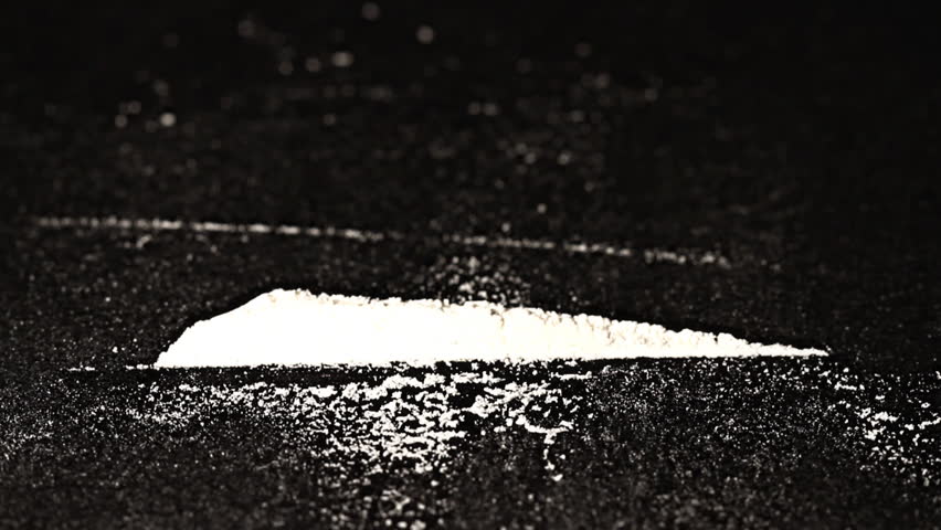 Hard drug - addiction concept. ILLUSTRATION! The white powder is flour before anyone think something else :-)  Studio setup with professional lighting and dolly motion.
