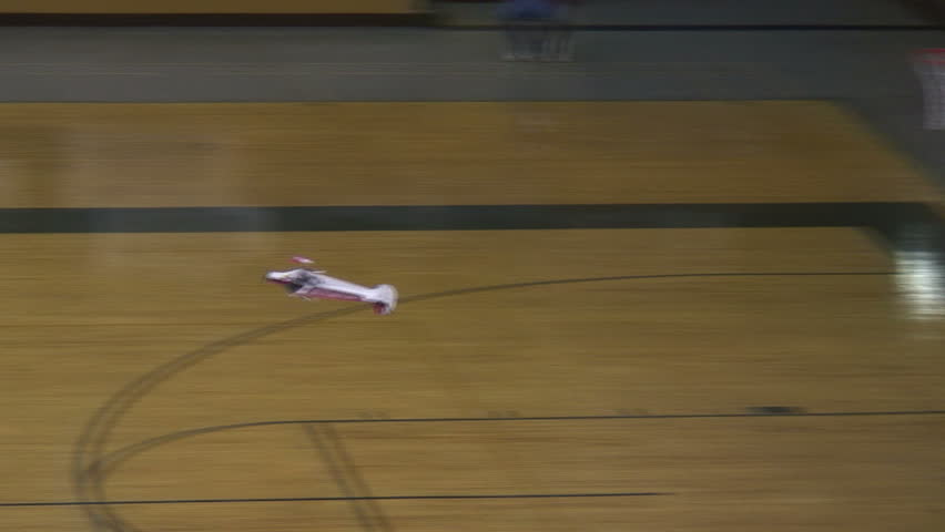 Radio-controlled foam model airplane performing aerobatic tricks at the competition venue