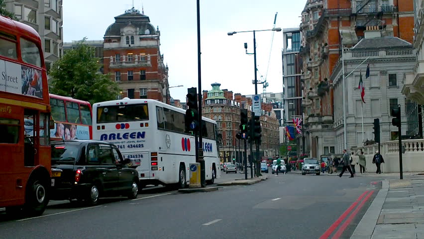 LONDON - CIRCA SEPT 2010: Foot and vehicle traffic on a busy street, circa September 2010 in London.  
