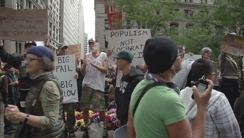NEW YORK - OCTOBER 2: Demonstrators at Occupy Wall Street protest, New York, October 2, 2011. OWS is an ongoing protest against social and economic inequality, corporate greed, and the influence of corporate money and lobbyists on government. 