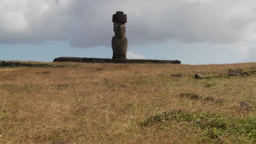 Wind blows across the grass in this lonely Easter Island scene.