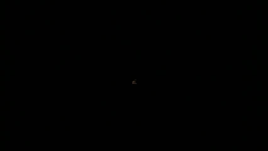 An exciting point of view shot from the front of a train coming out of a long tunnel at high speed.