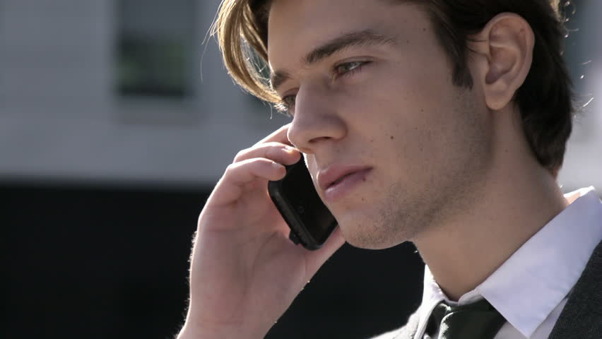 Young businessman talking on the telephone