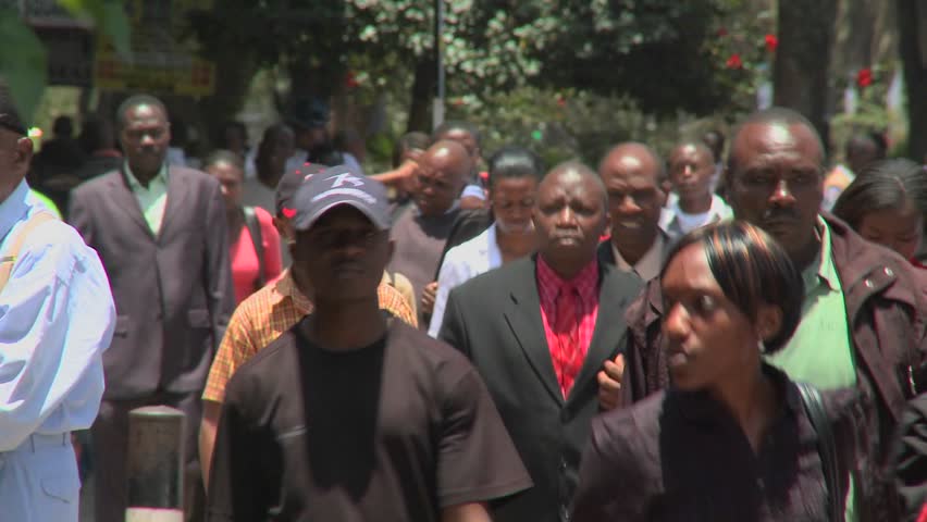 NAIROBI, KENYA - CIRCA 2009:  Crowds of pedestrians walk on the modern streets circa 2009 in Nairobi, Kenia.