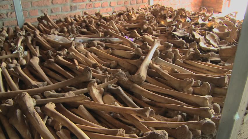 Leg bones of skeletons in long rows offer a grim remembrance of the Rwanda genocide.