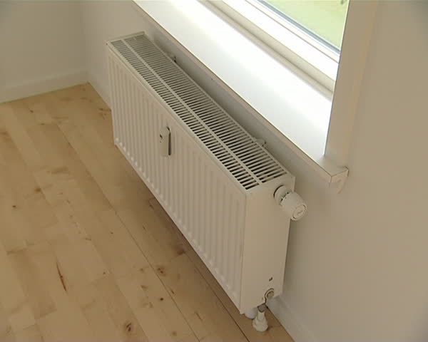 Heating control and accounting mechanisms in newly built flat. View though window. 